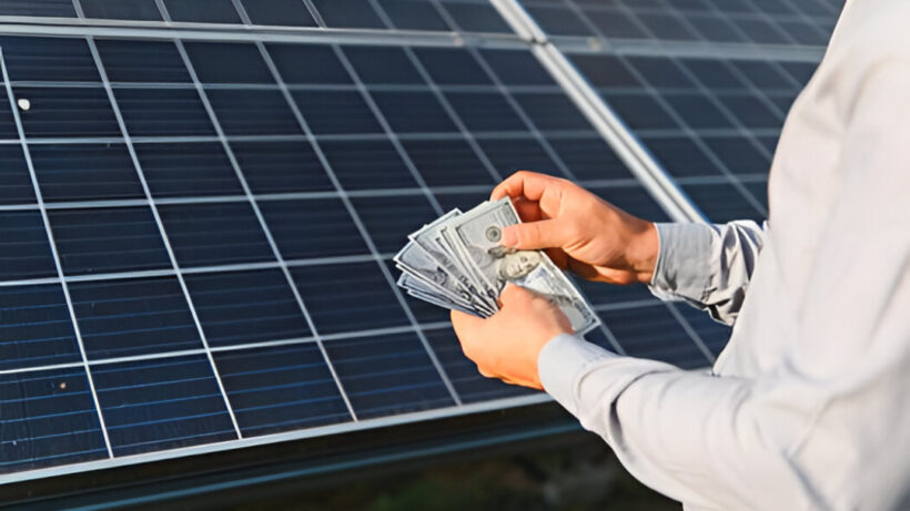 Homeowner calculating savings from rooftop solar panels, highlighting strong return on investment offered by the best solar company in Kerala.