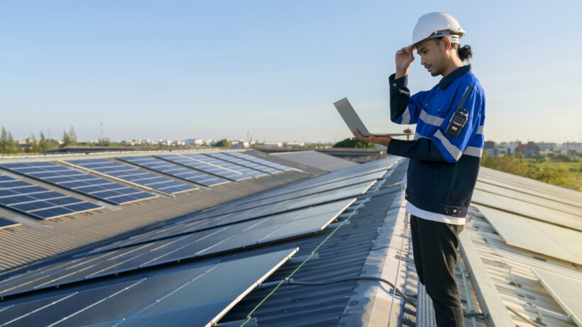 Technician inspecting rooftop installation of the best solar panels in Kerala for efficient performance and long-term maintenance