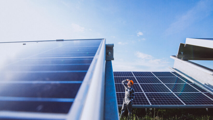 Technician inspecting solar panel installation, highlighting the quality services offered by solar companies in Calicut for efficient and reliable energy solutions.