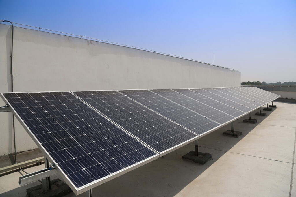 Rooftop hybrid solar panel installation by solar companies in Ernakulam for efficient energy savings and backup power